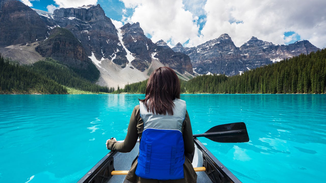 Woman canoeing in the Canadian Rockies 