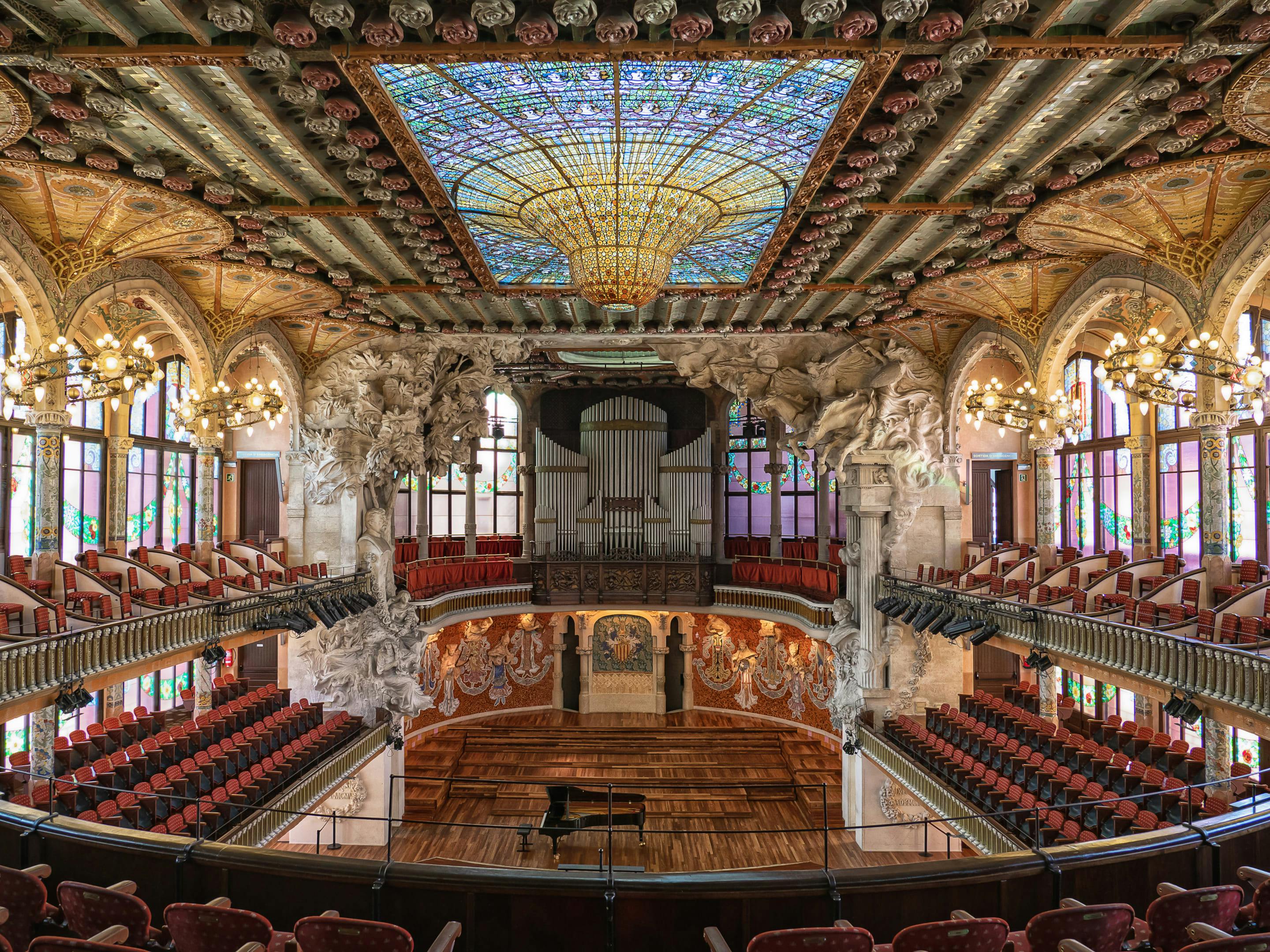 Palau de la Musica Catalana's interior showcases a magnificent stained glass ceiling.