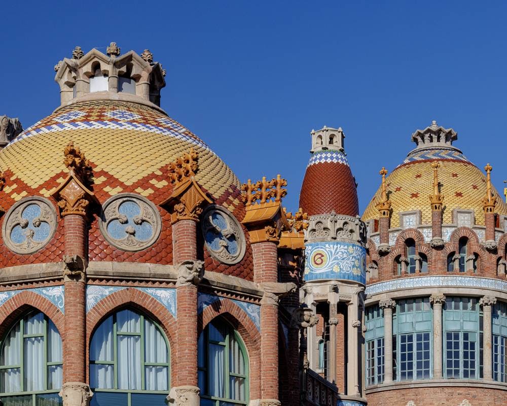 Colorful and intricate domes of Sant Pau's Hospital, showcasing ornate architectural beauty.