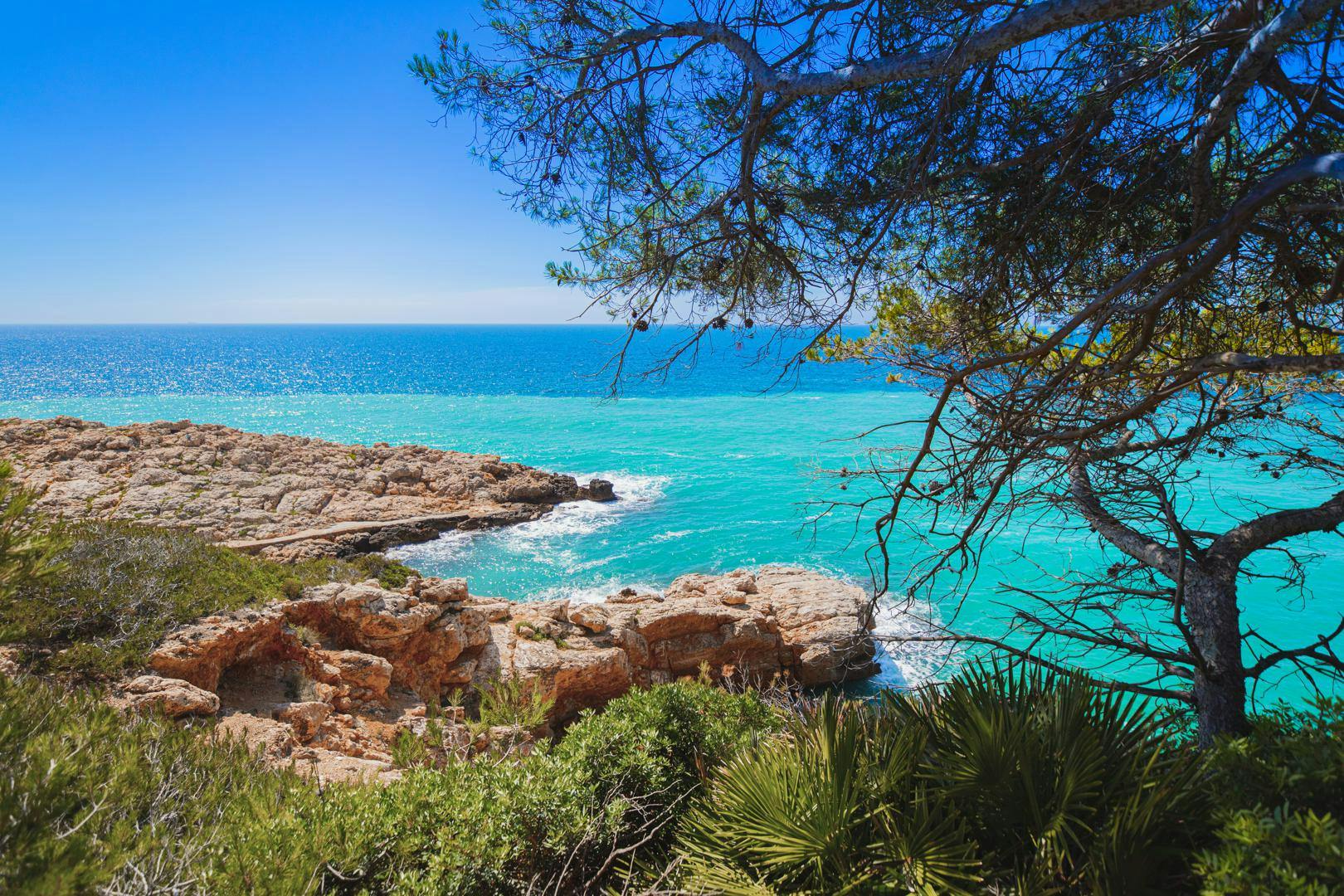 View of the turquoise sea and rocky coast in Salou, southwest of Barcelona, Spain.