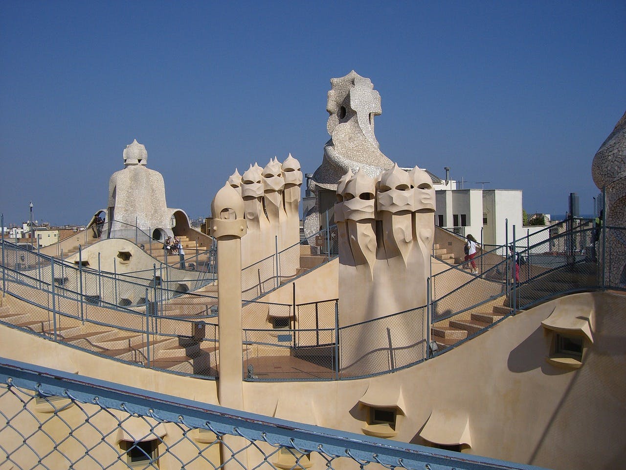 A stone building known as Casa Mila stands tall, showcasing its sturdy and timeless construction.