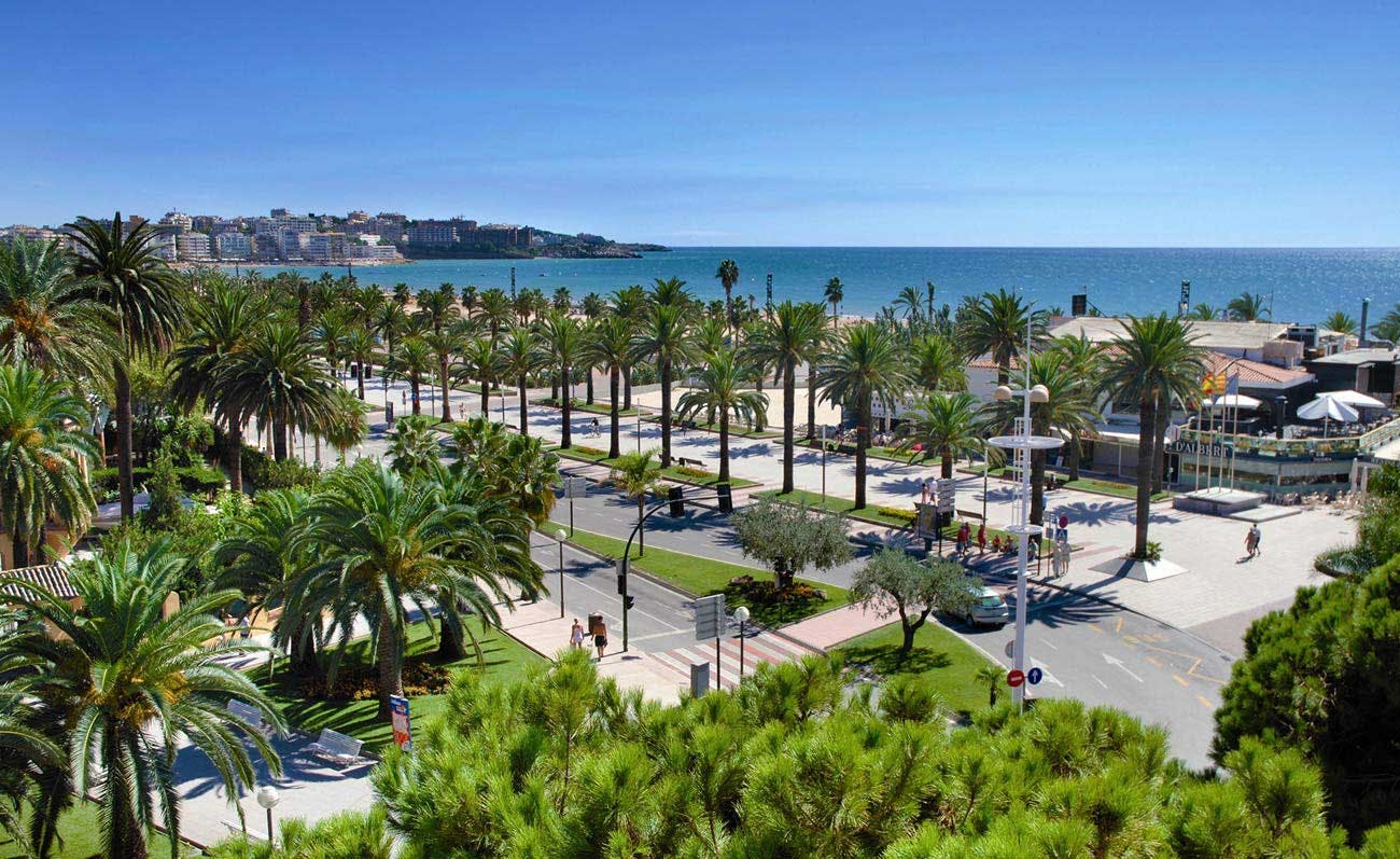 A scenic promenade with palm trees located in Salou, a city popular among travelers.