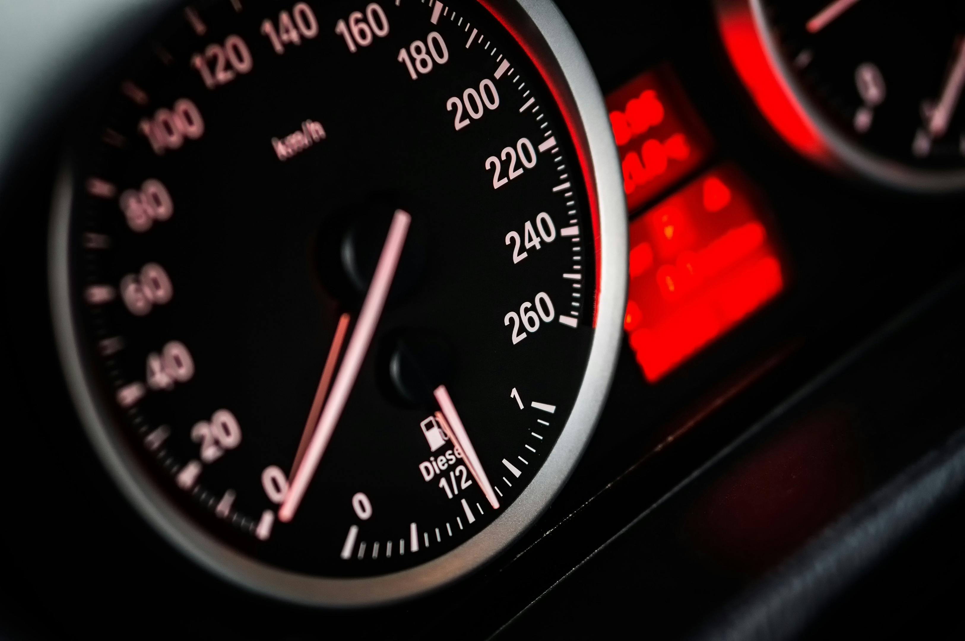 Close-up of a speedometer in a car, displaying the speed.