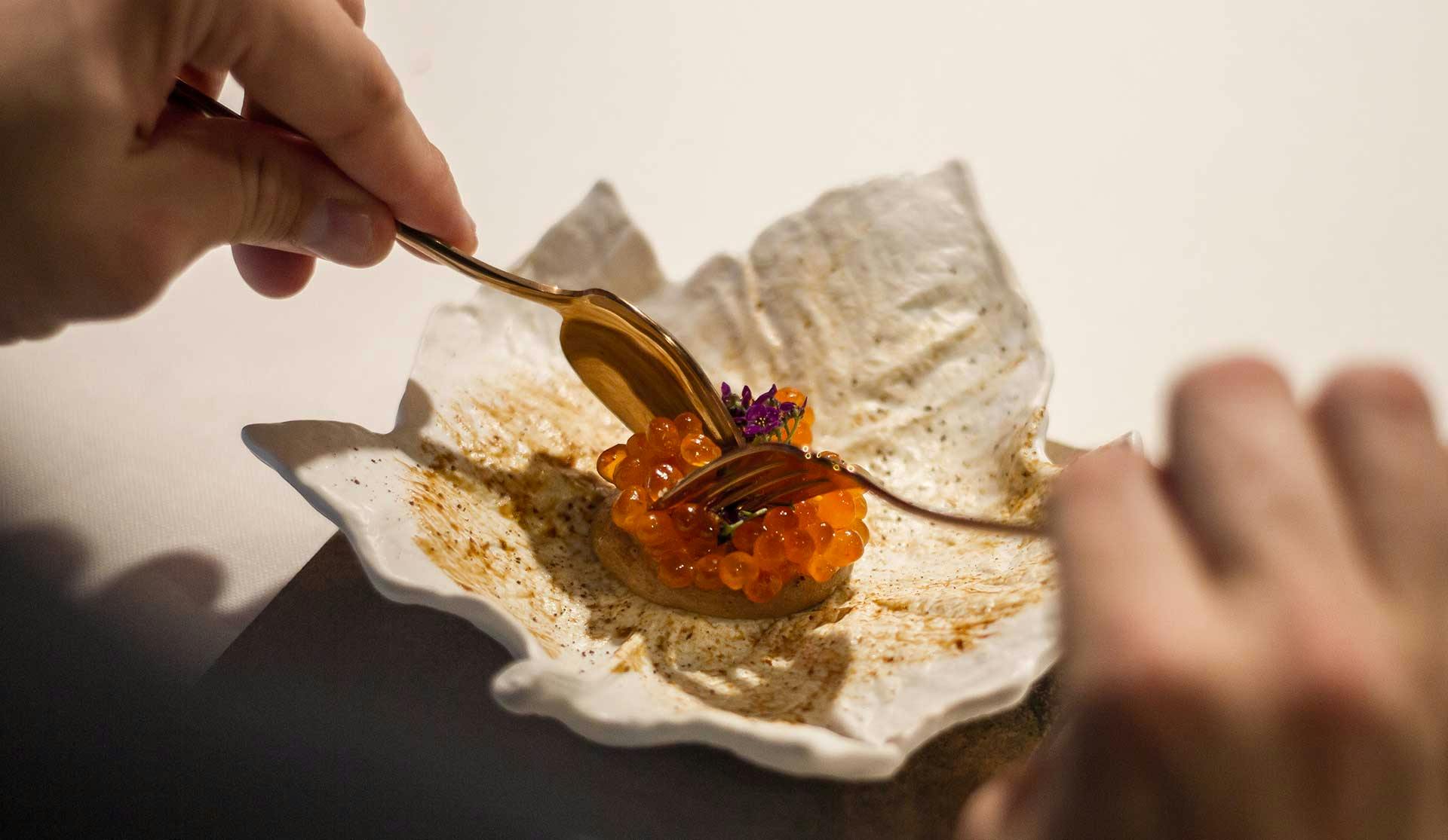 A diner relishing a small dish at Deliranto, one of Salou's best restaurants.