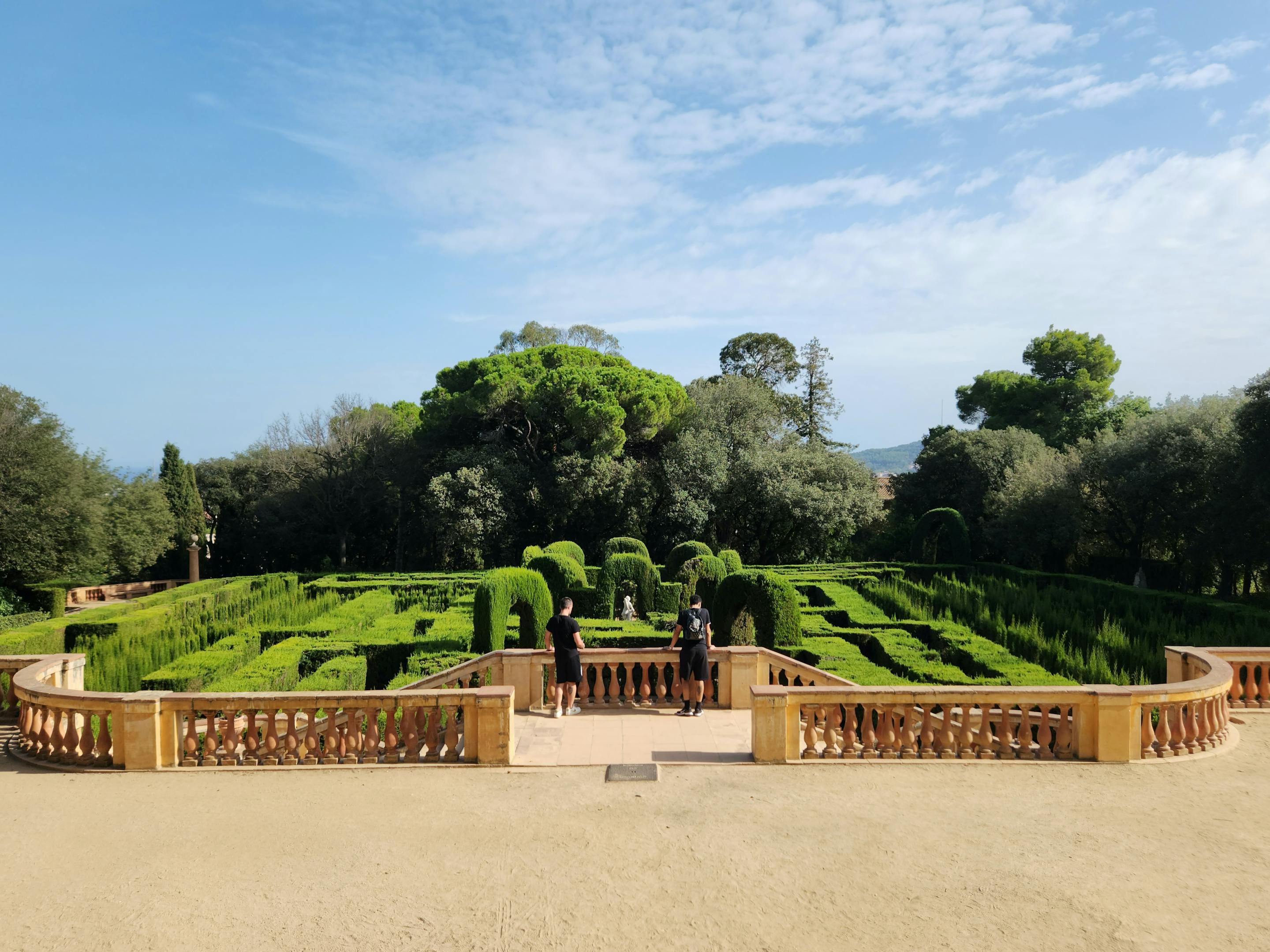 Aerial view of Laberint d'Horta, a large garden with a circular labyrinth structure in Barcelona.