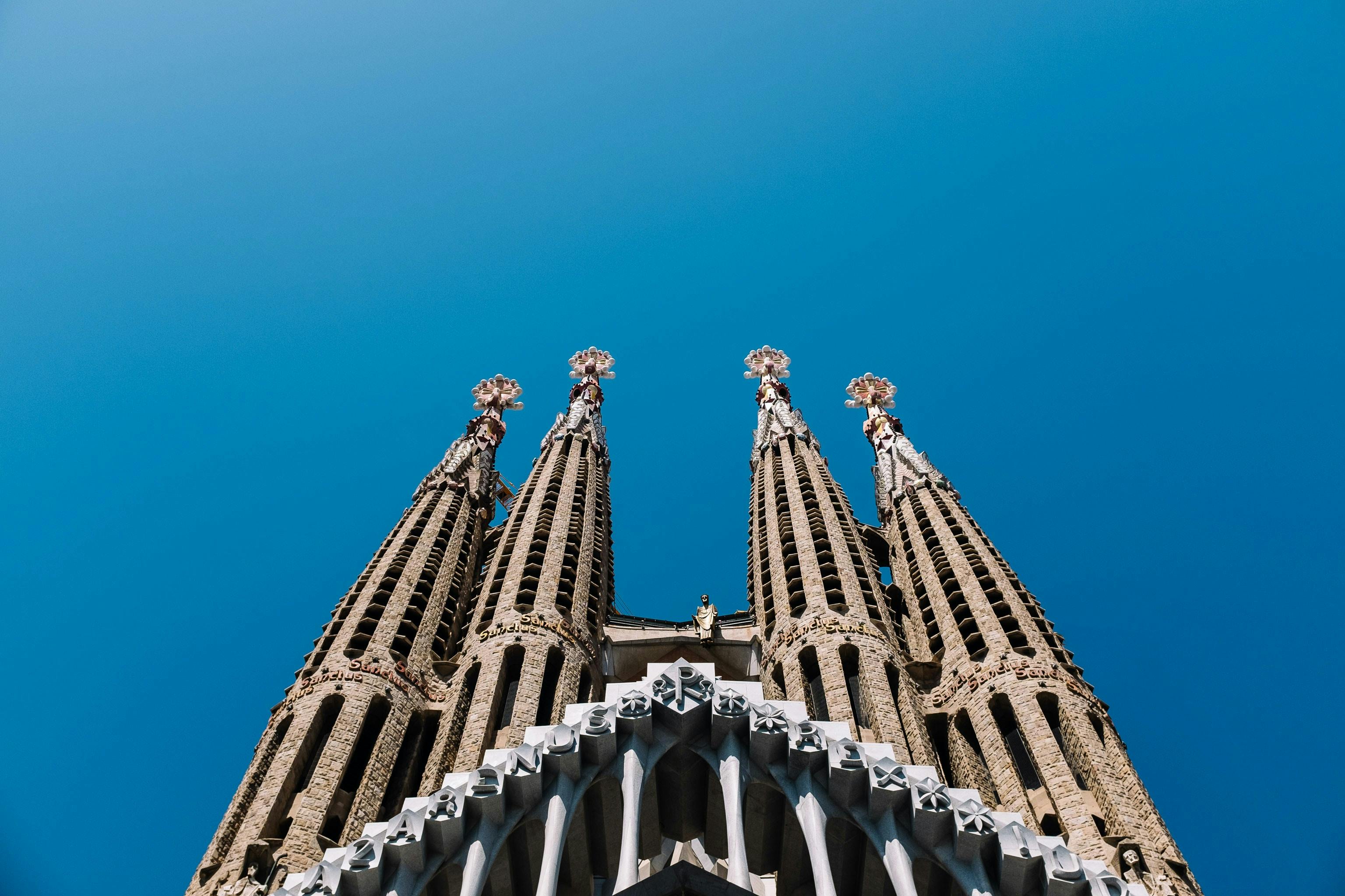 Iconic Sagrada Familia cathedral spires in Barcelona, Spain, a testament to architectural brilliance.