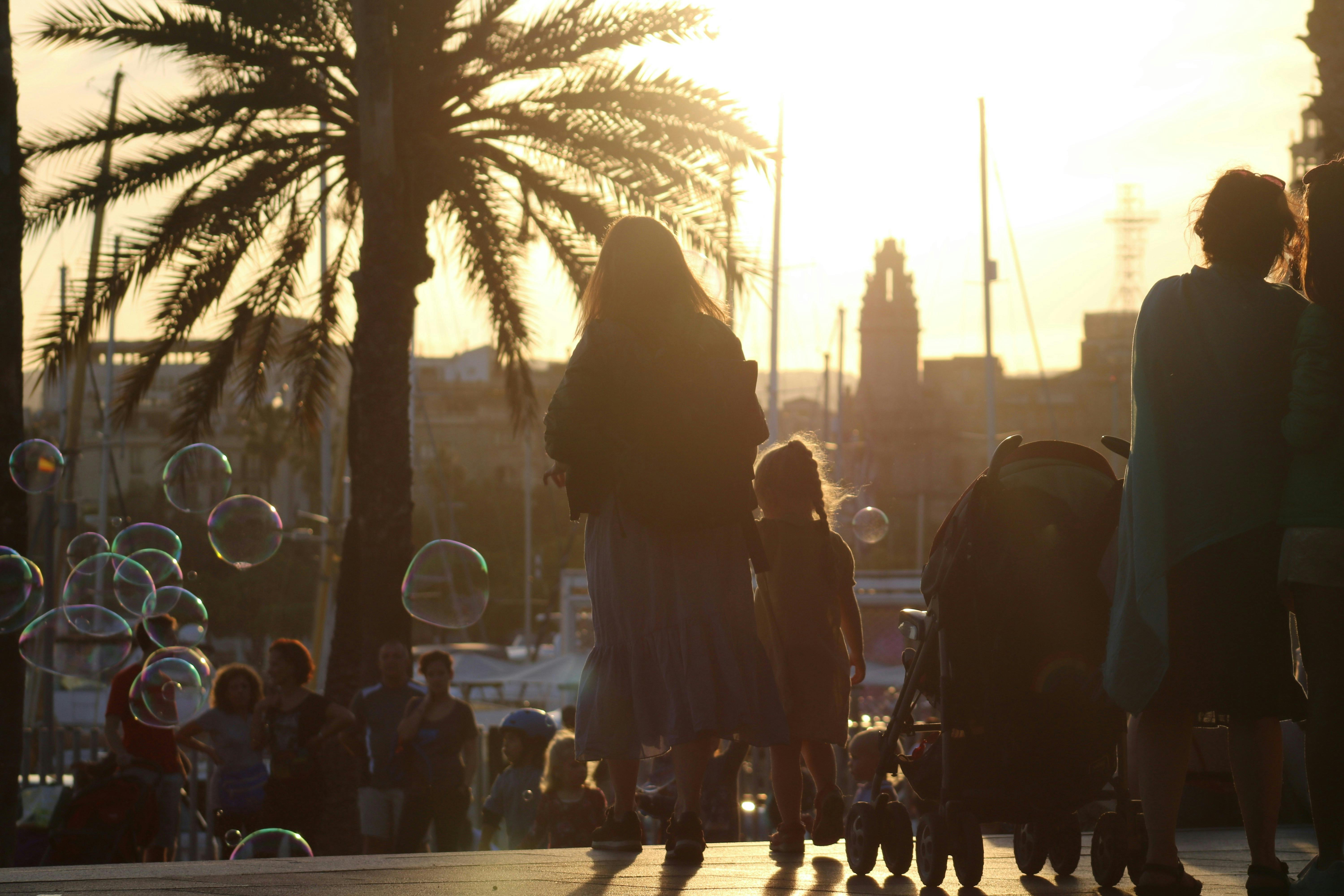 Barcelona with kids: A family exploring the city's vibrant streets and visiting famous landmarks.