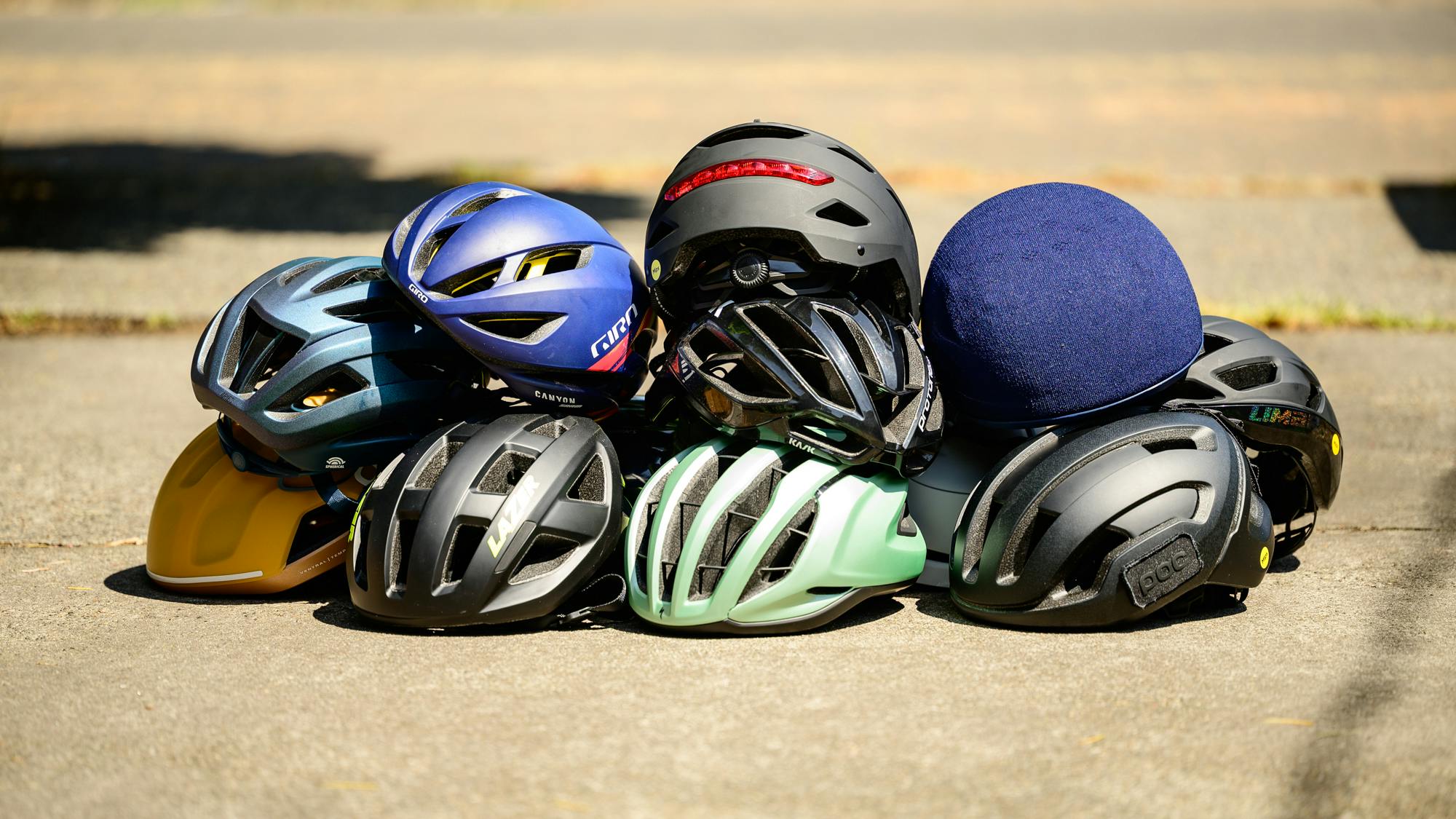 A stack of bike helmets neatly arranged, ready to protect cyclists' heads.