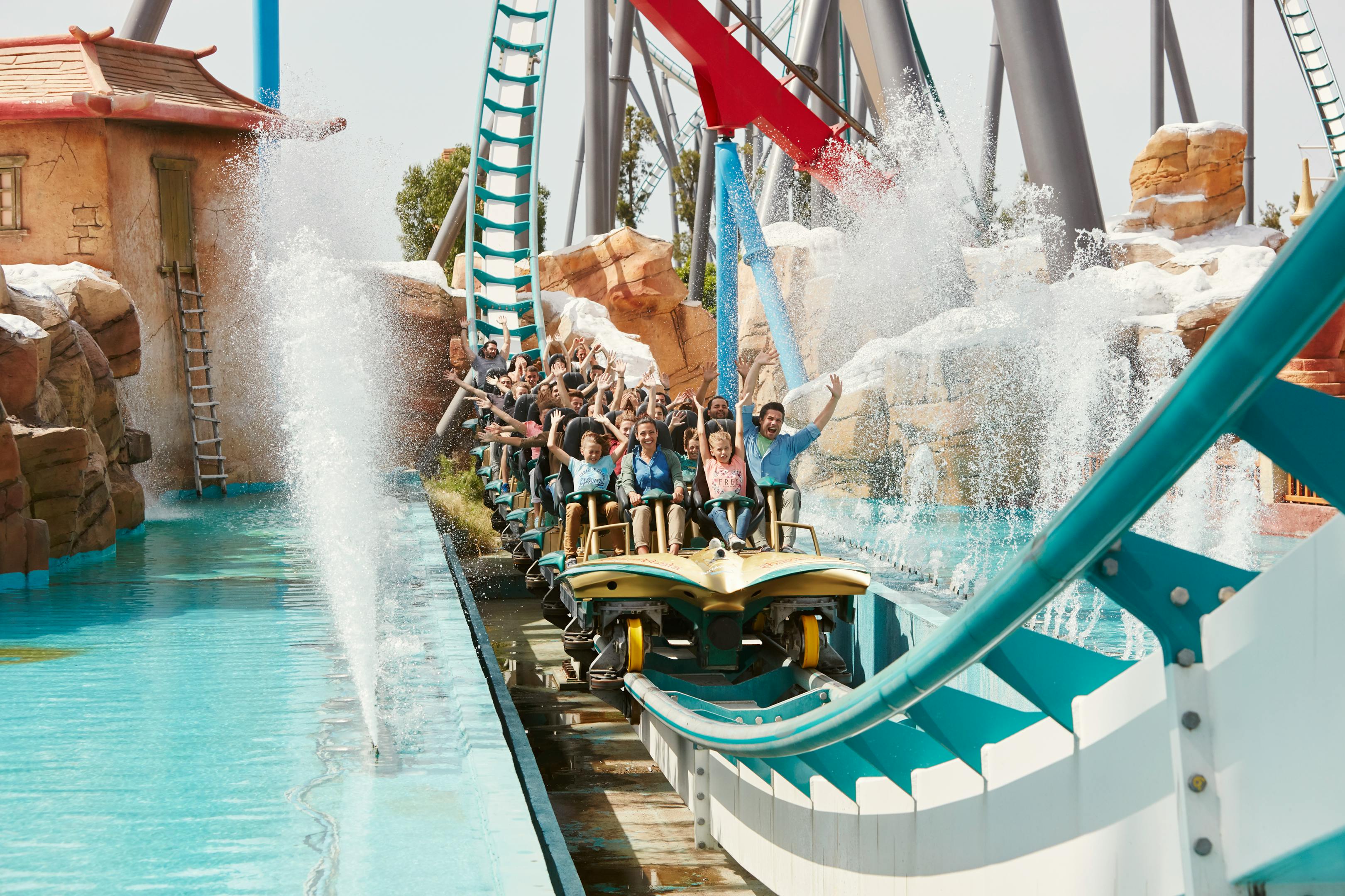 A group of people enjoying a thrilling roller coaster ride at PortAventura World, Salou.