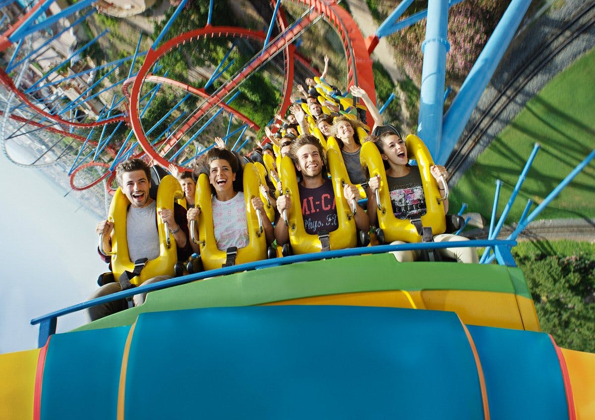 A thrilling roller coaster ride at PortAventura Park, with a group of people enjoying the adrenaline rush.