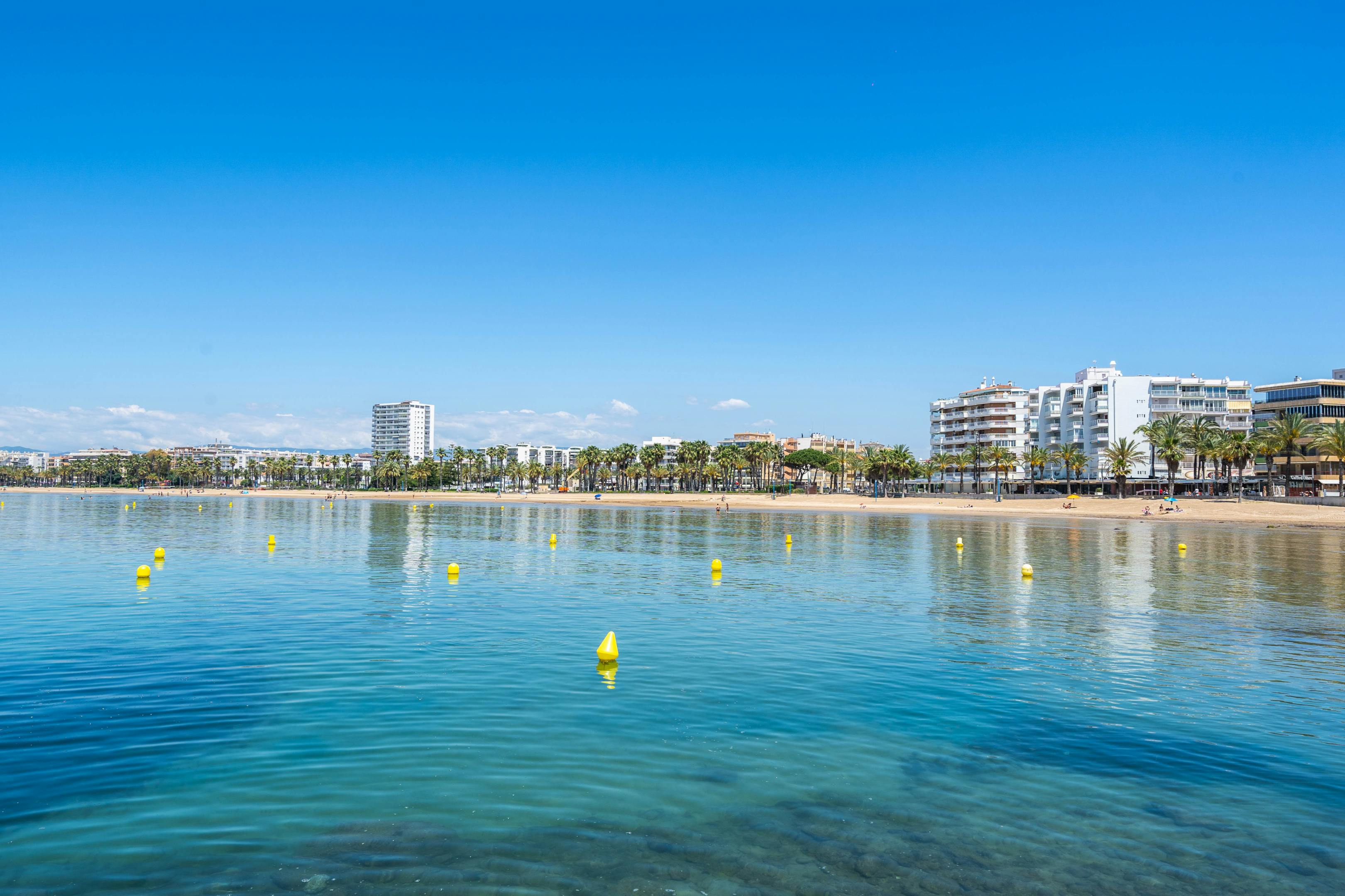 Llevant Beach, Salou: A picturesque beach with golden sand and clear blue waters.