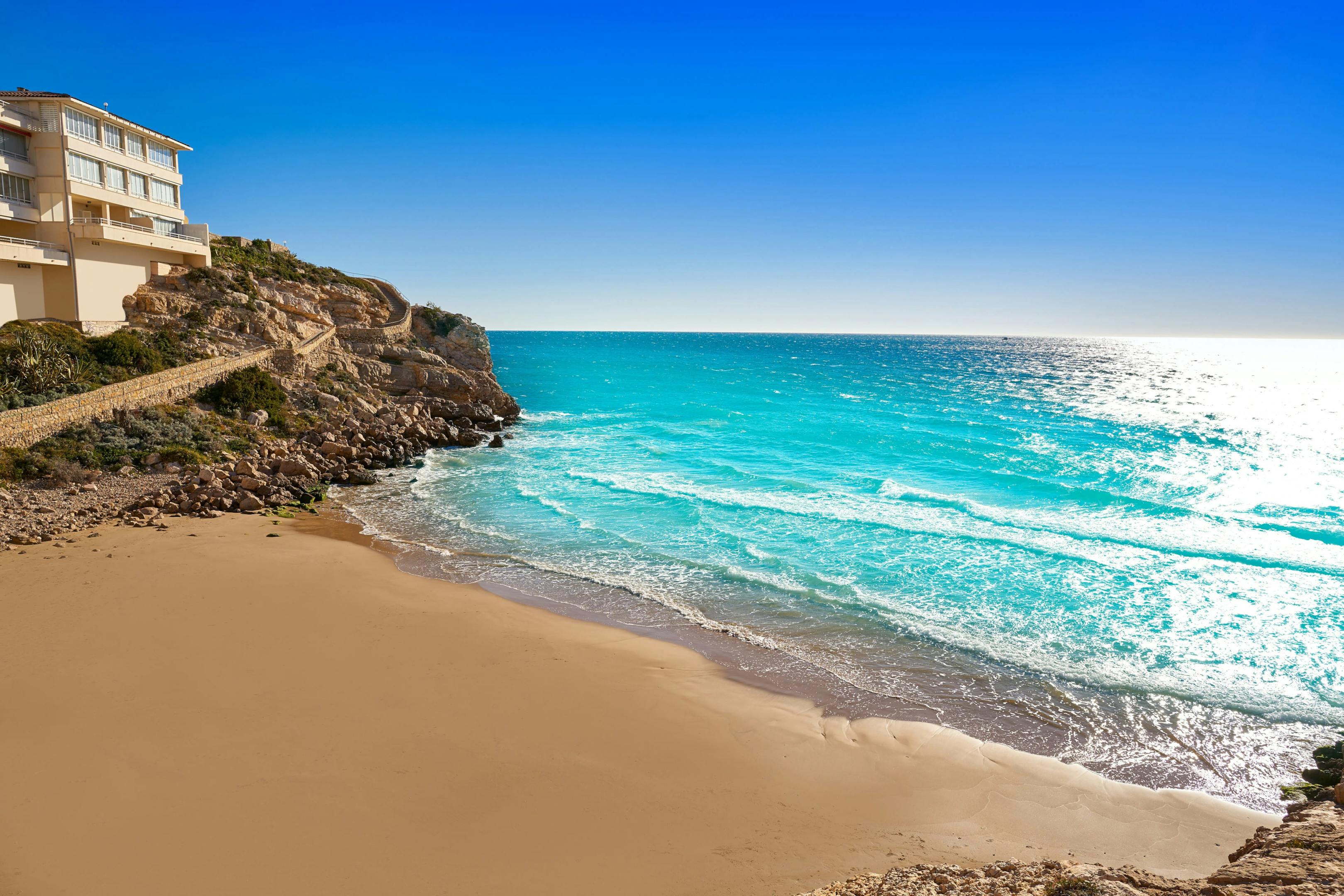 A stunning beach view with a house on a cliff, Playa Llenguadets, Salou.