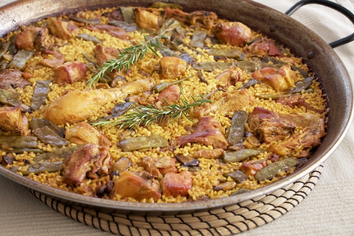 A traditional paella valenciana, cooked to perfection.