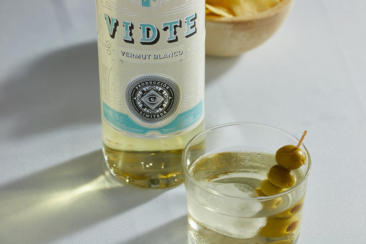 A glass of Vermouth inviting you to savor this delightful alcoholic drink.