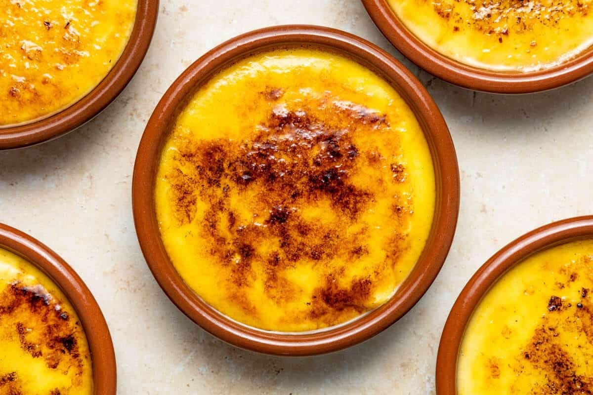 Small bowls of crema catalana, a desser similar to crème brûlée.