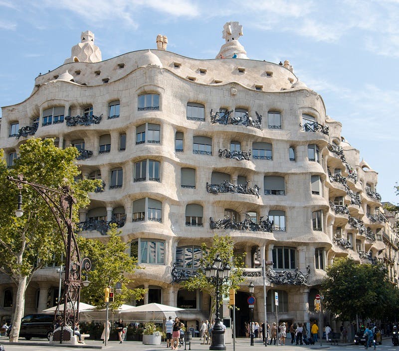 Exterior of La Pedrera building on Passeig de Gracia, showcasing unique architectural design.