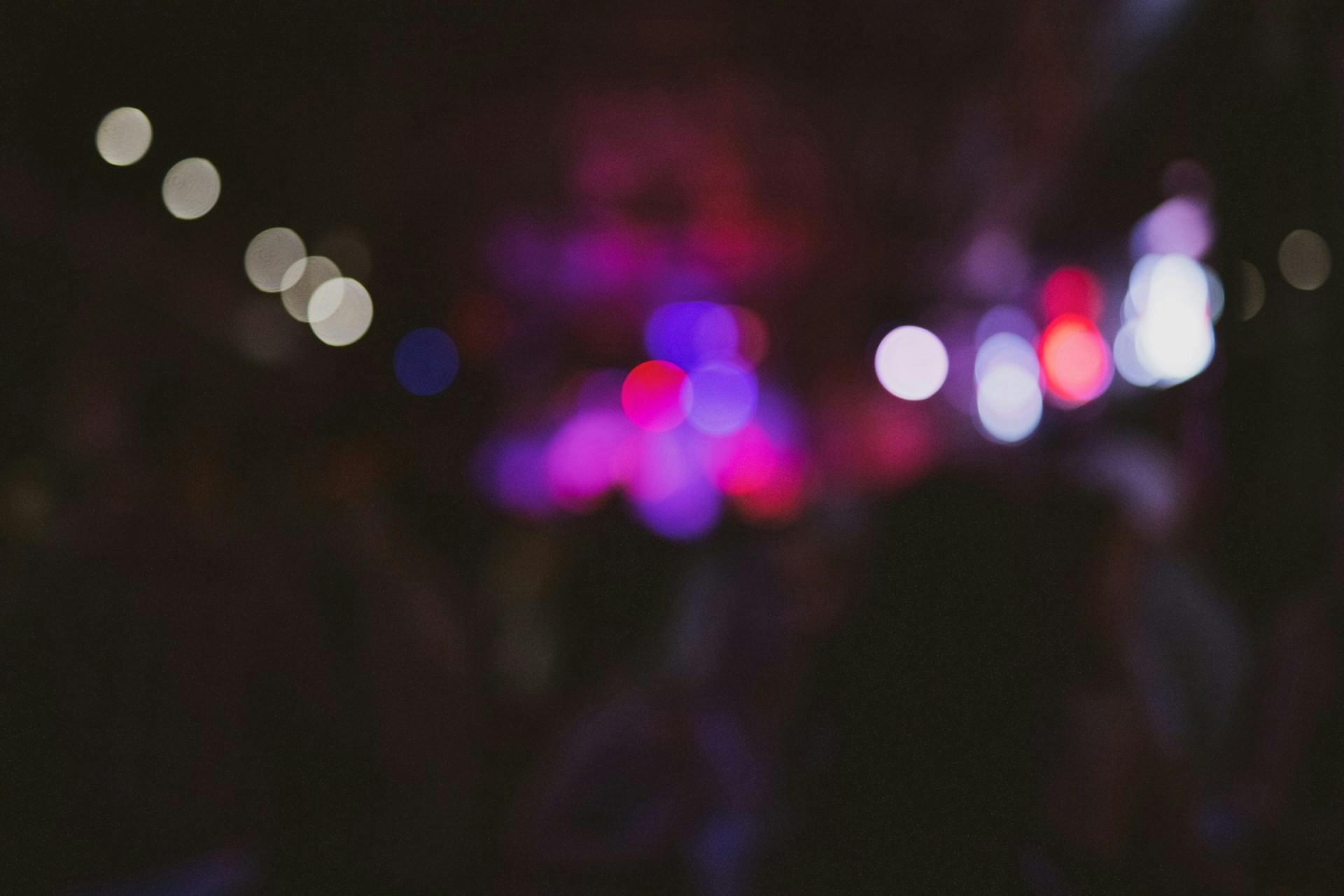 Blurred image of people enjoying nightlife in Salou at a party.