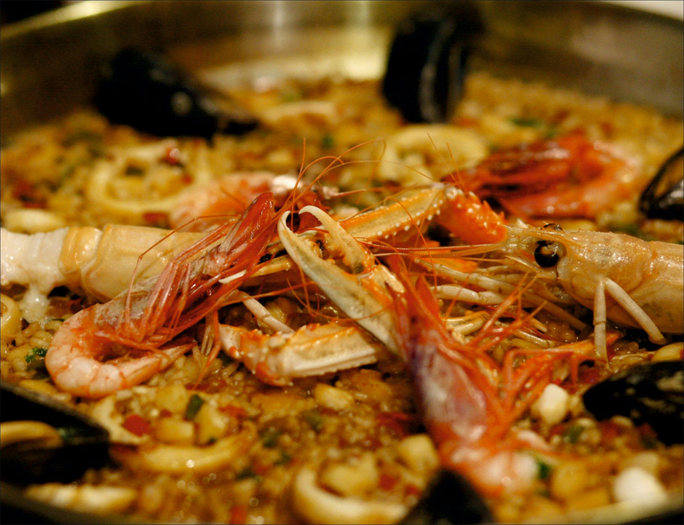 A delicious seafood and rice dish served at O Xantar Mediterraneoa restaurant in Salou.