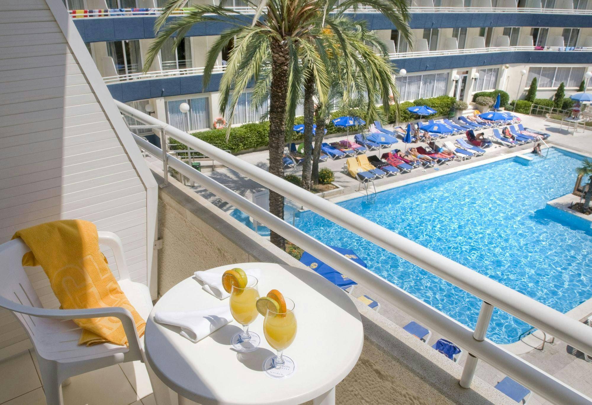 A breathtaking view of the pool and beach from the balcony of a hotel in Lloret de Mar.