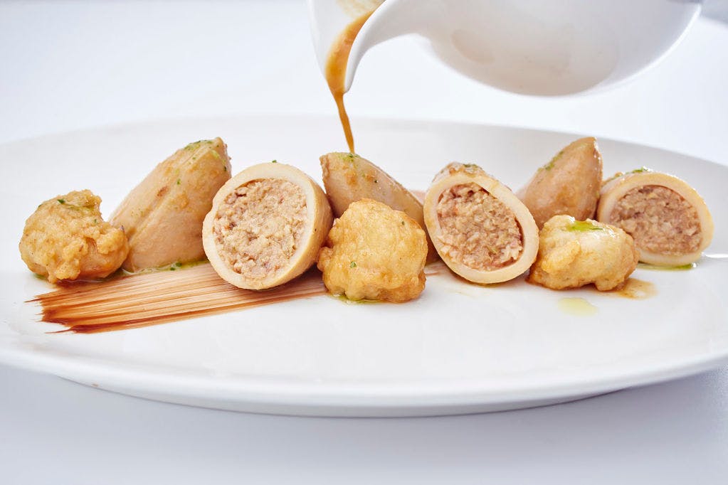 A plate of food on a white plate at a restaurant in Lloret de Mar.