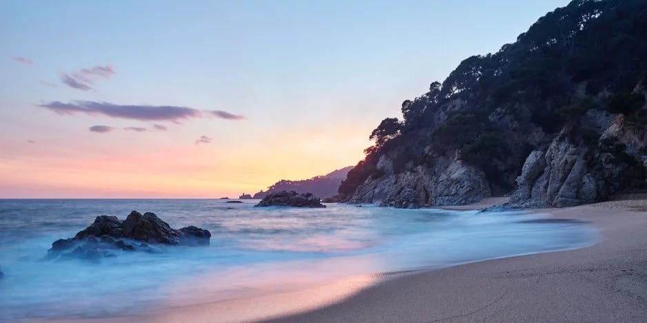 A beach at sunset.