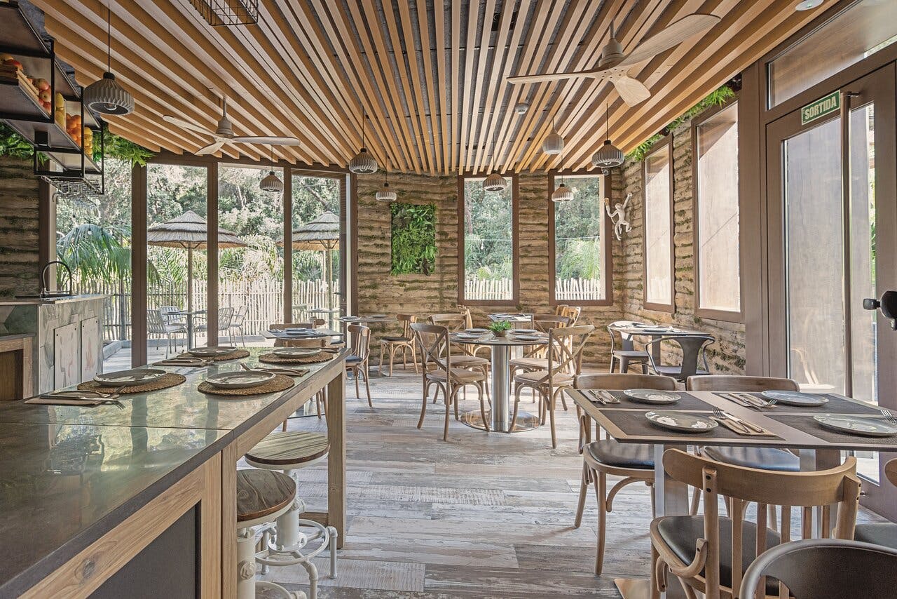 Lloret de Mar restaurant with rustic wooden walls and ceiling.