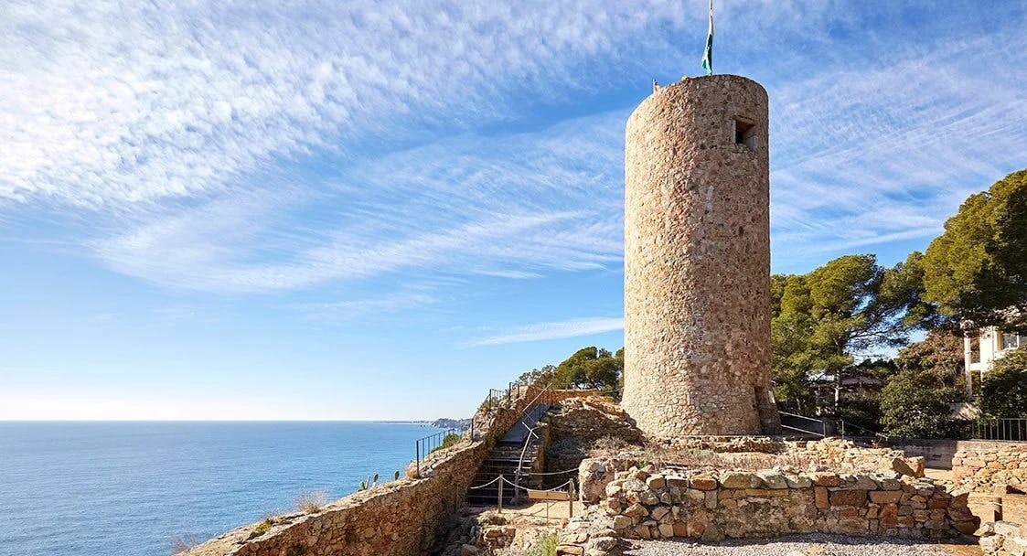 Castle tower on cliff.