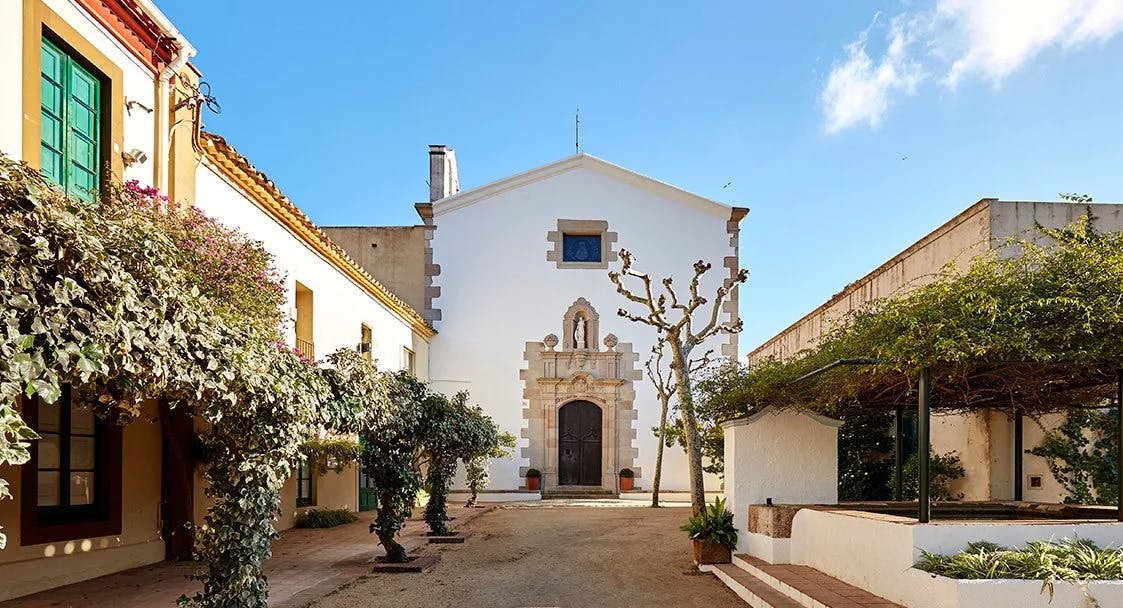 Courtyard with church and trees.