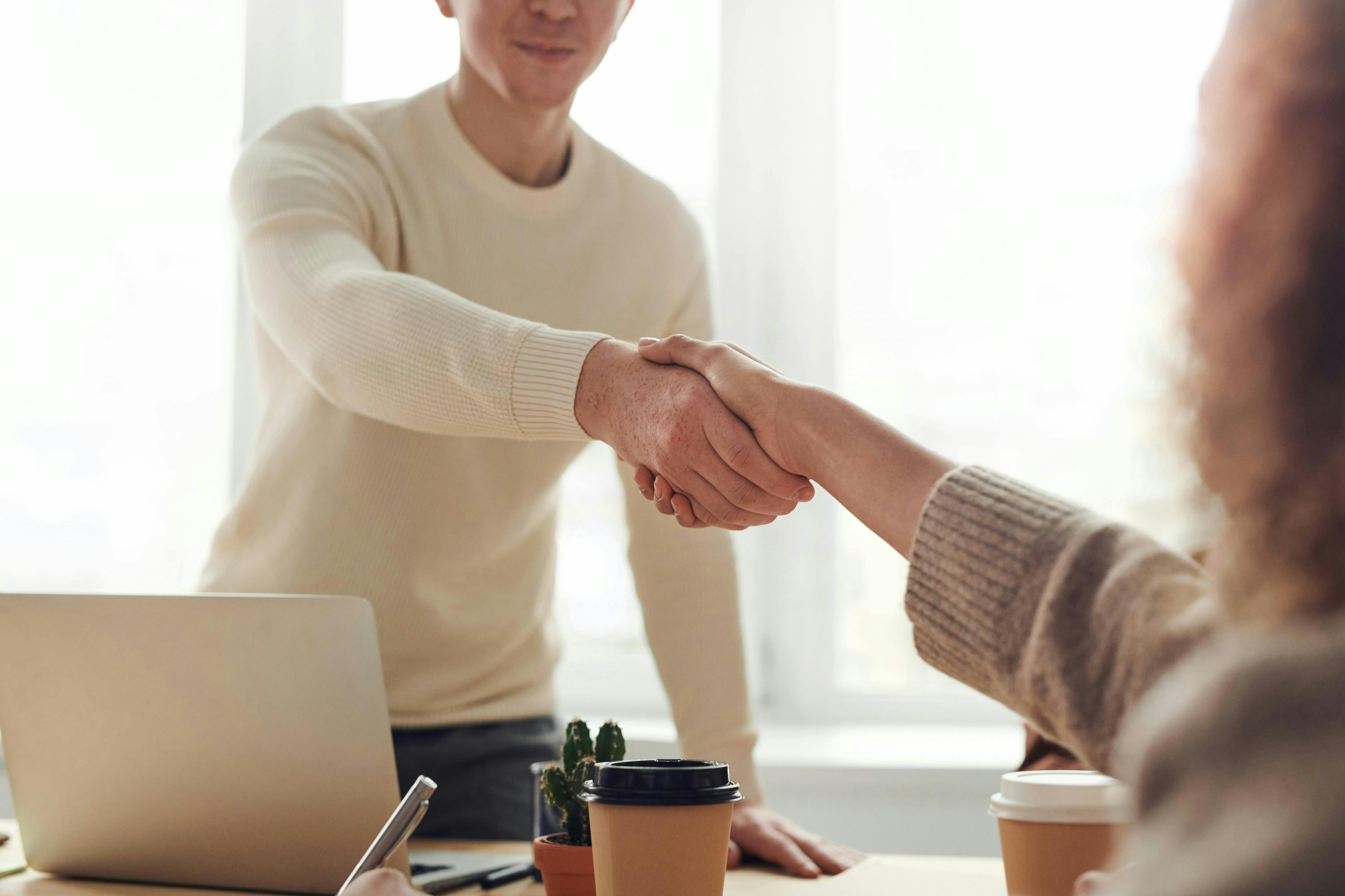 A man and woman shaking hands. 