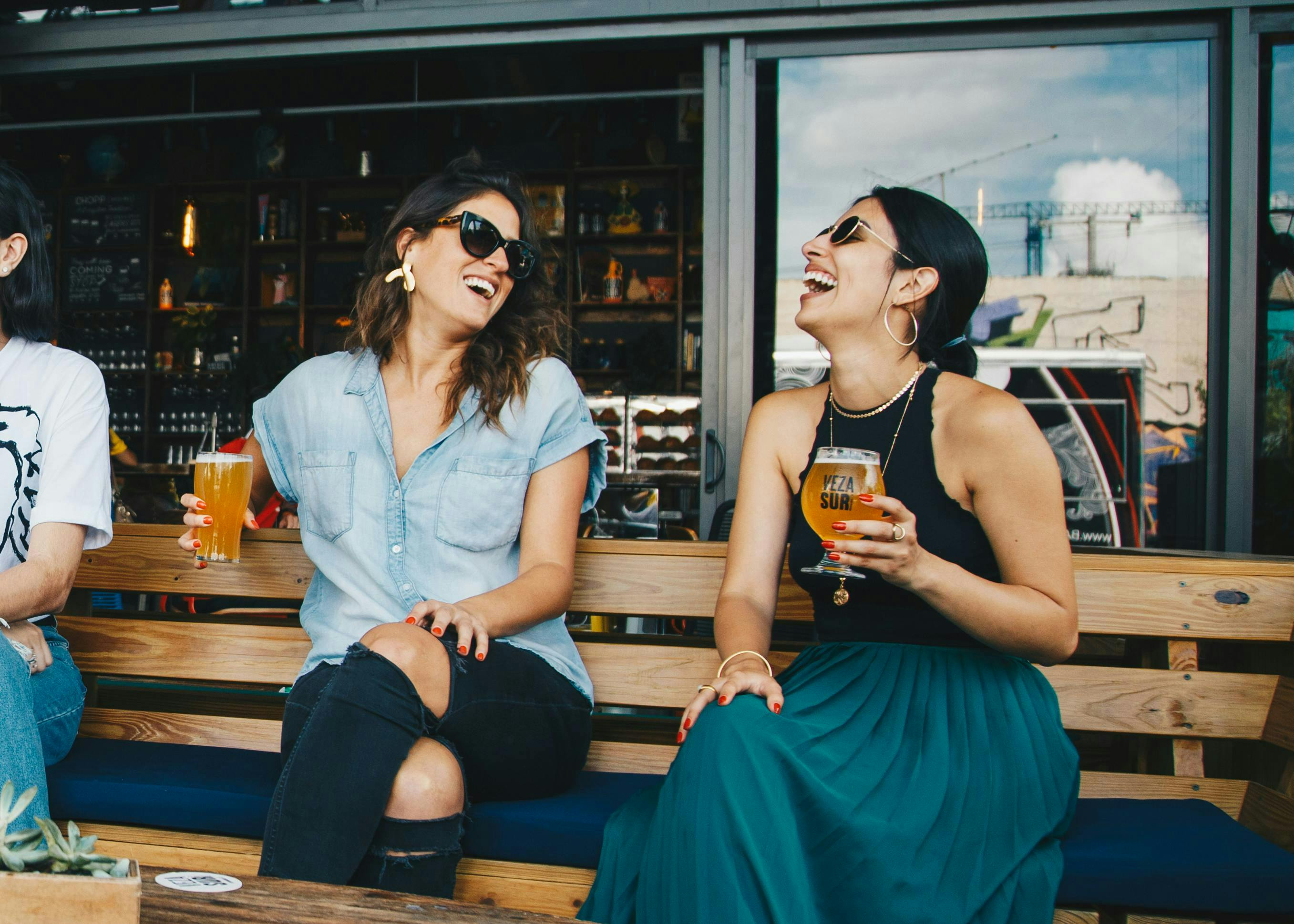 Girls smiling drinking beer