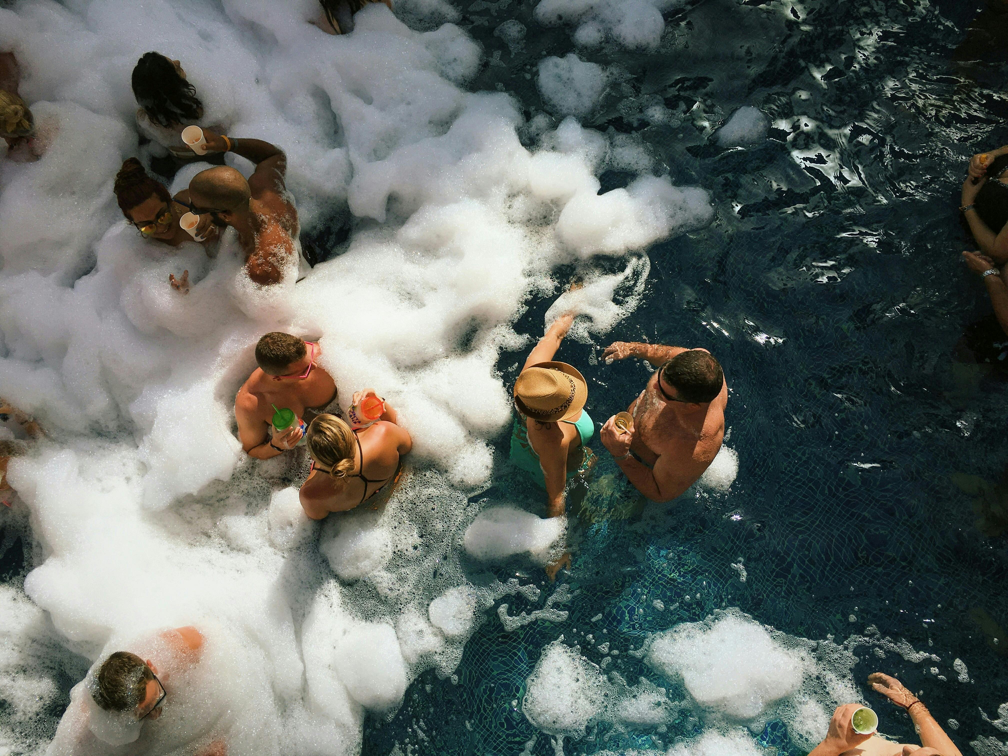 People enjoying a bubbly pool