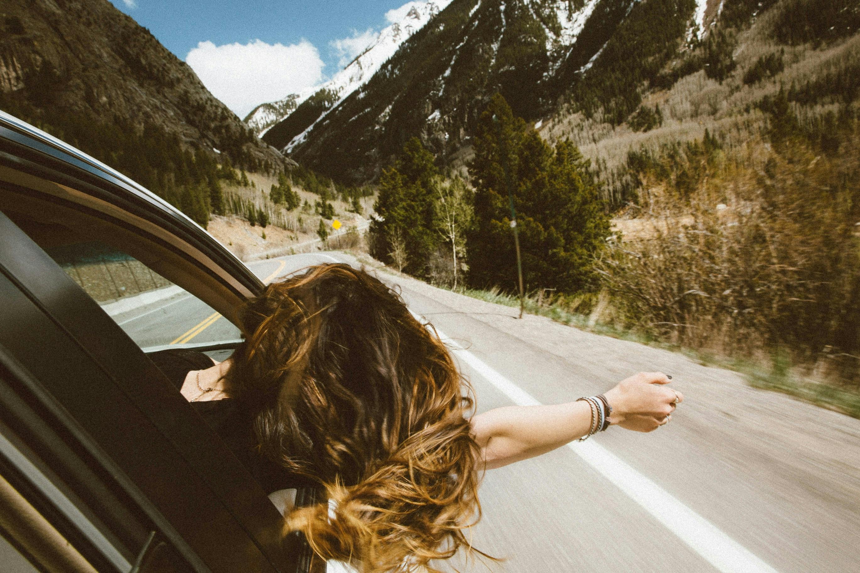 A woman on a road trip. 