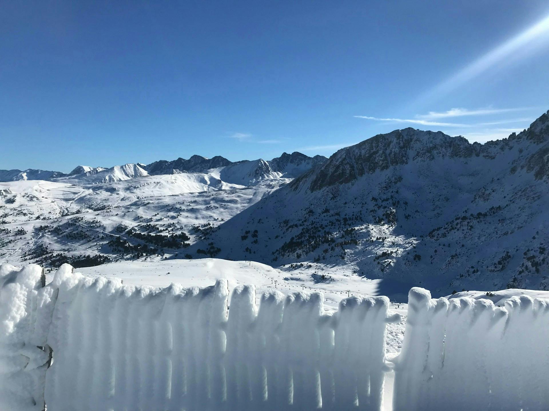 A snow fence in the mountains of Grandvalira.