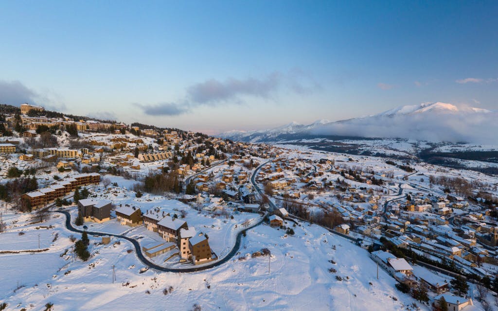 Snow-covered village with cozy houses