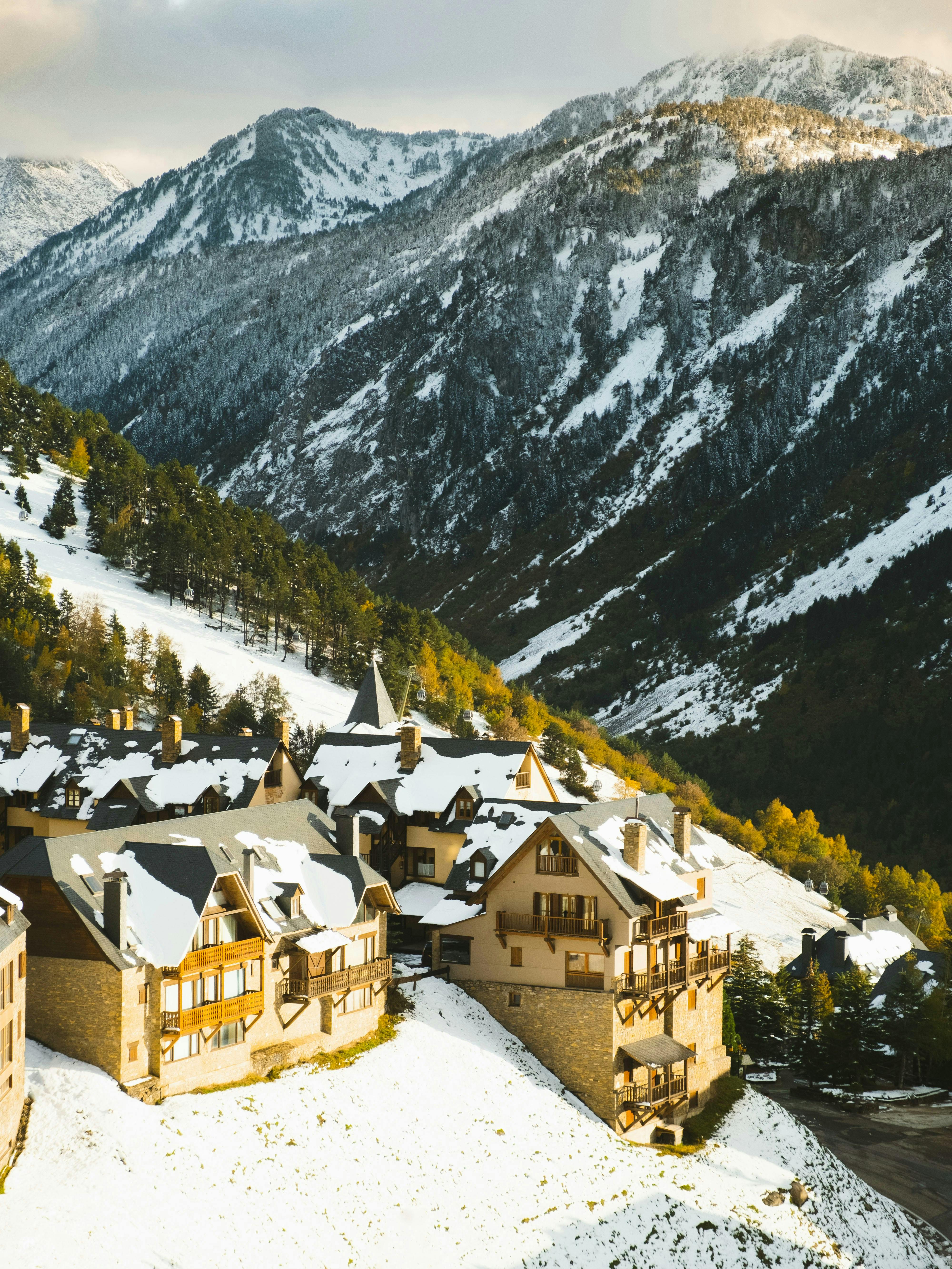 A ski resort in the mountains with snow on the ground at Baqueira Beret.