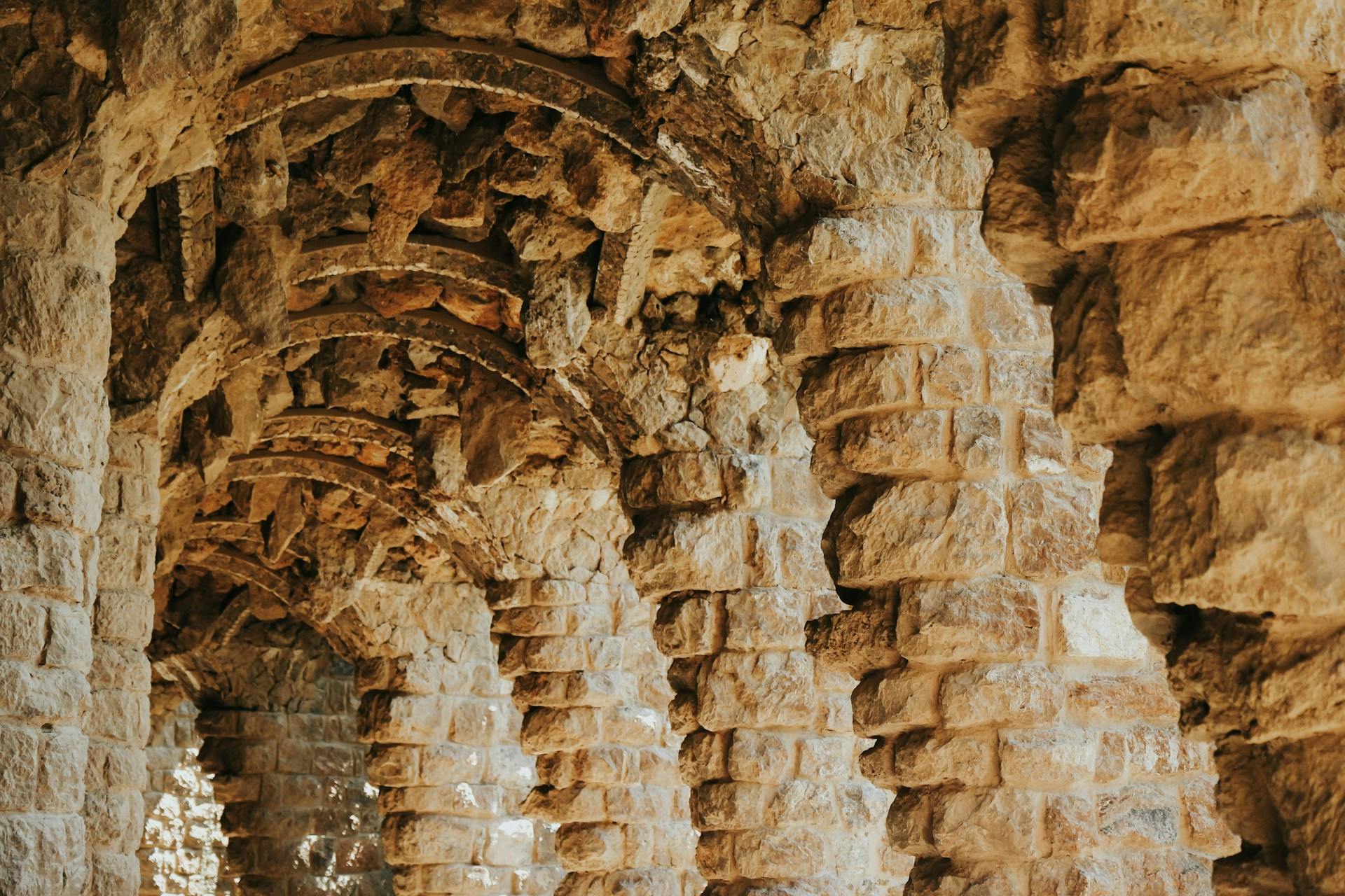 The iconic arches of the Park Güell in Barcelona, showcasing stunning architectural design and historical significance.