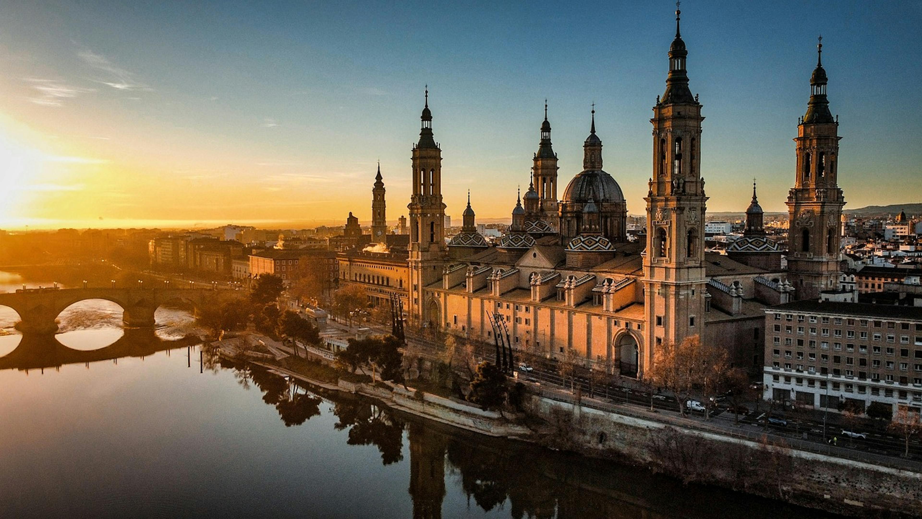 The sun sets beautifully over Zaragoza, Spain