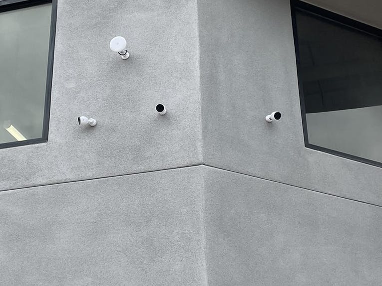 Security cameras installed on a building