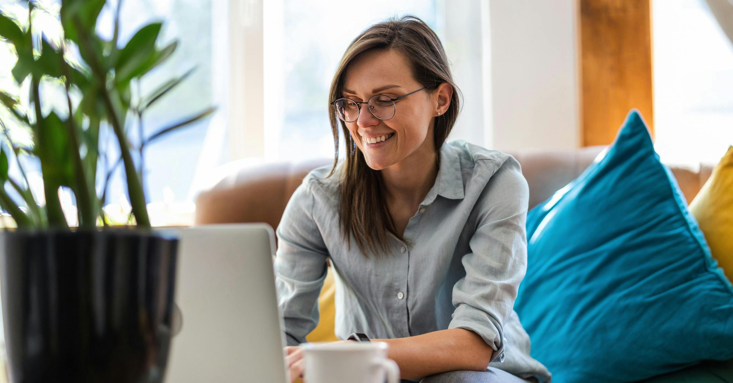 a young woman using a laptop at home
