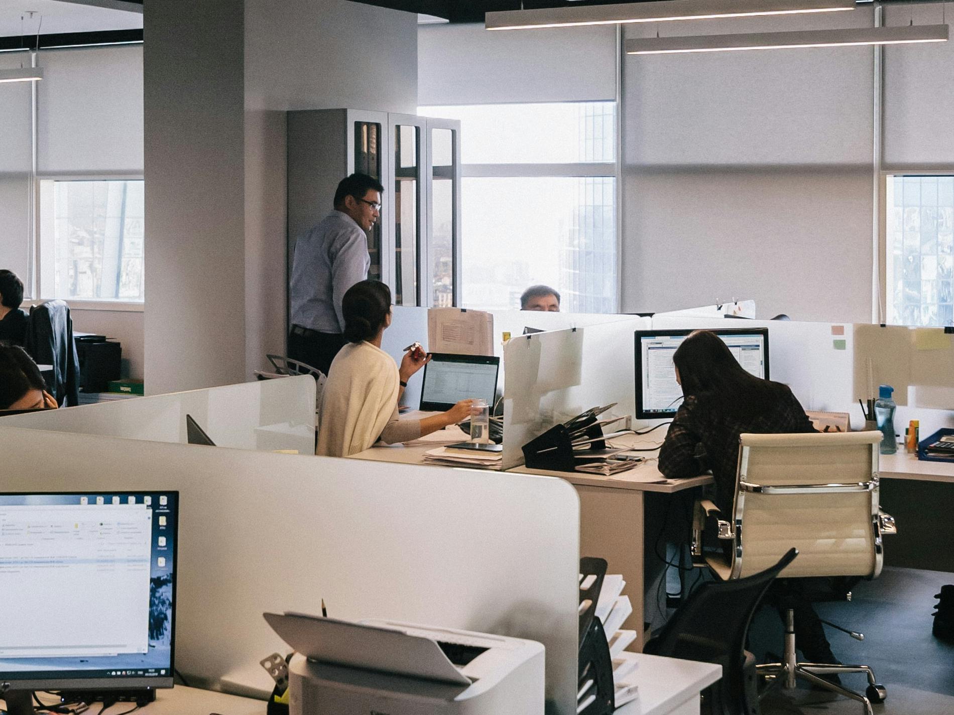 a busy office with people at desks