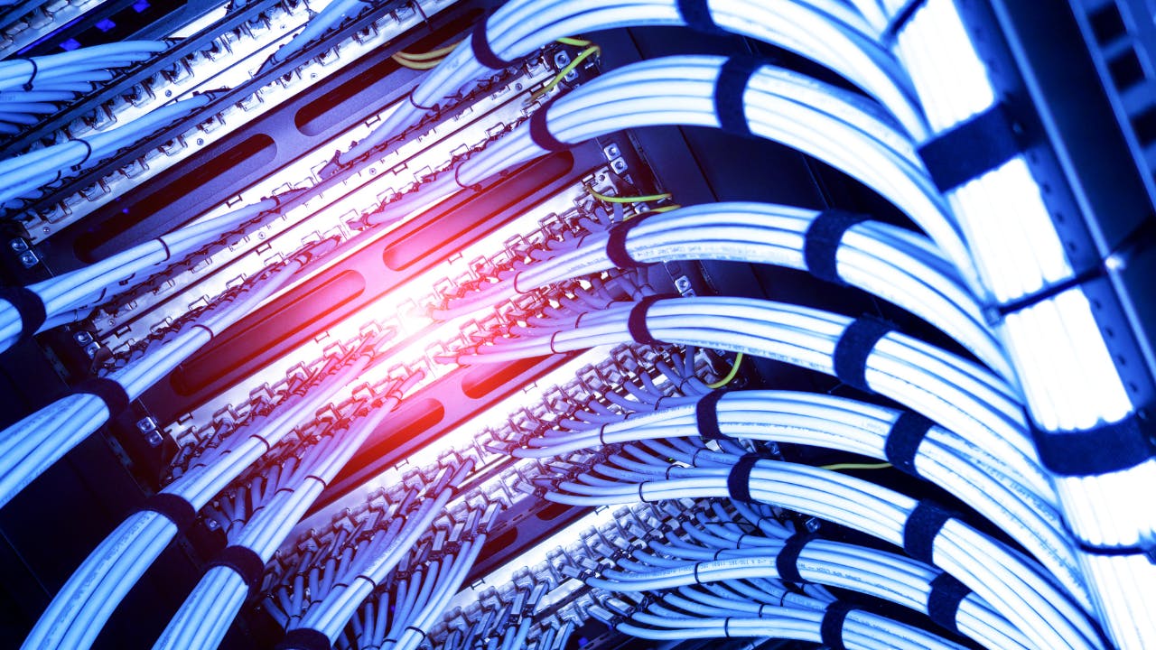 Example of Fiber Optic cables connecting to a server rack