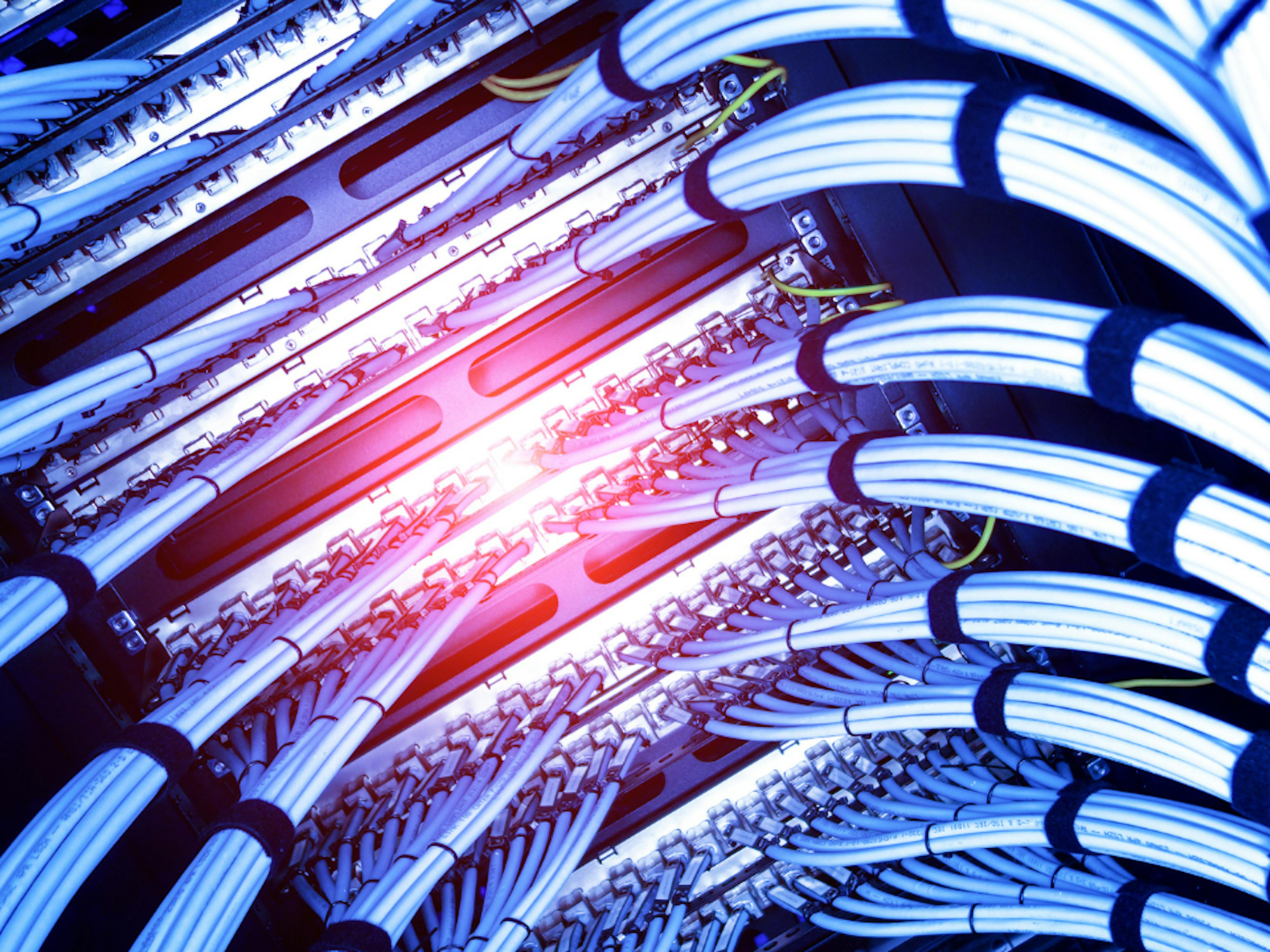 Example of Fiber Optic cables connecting to a server rack