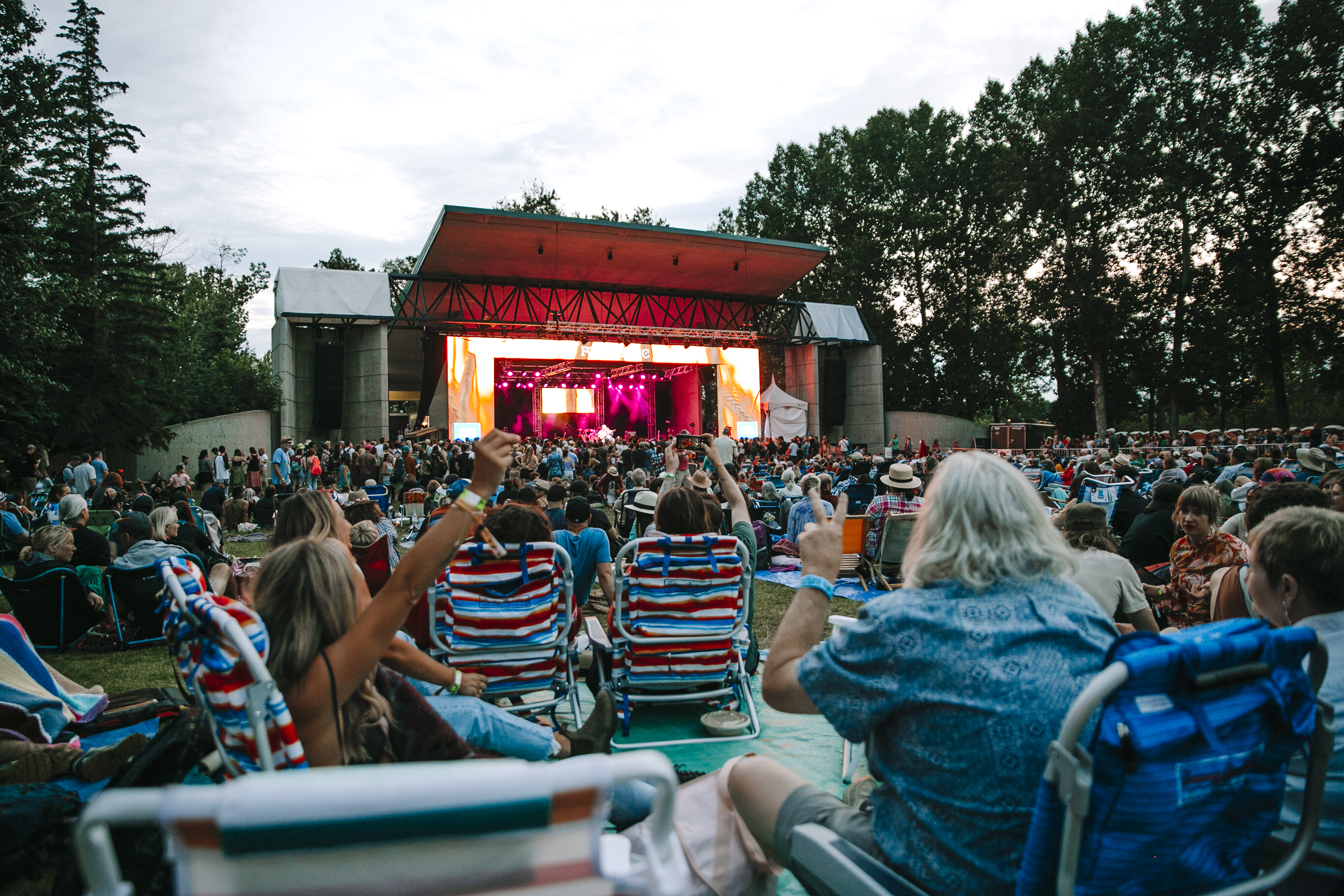 The Calgary Folk Music Festival mainstage is pictured with audiences gathered on tarps.