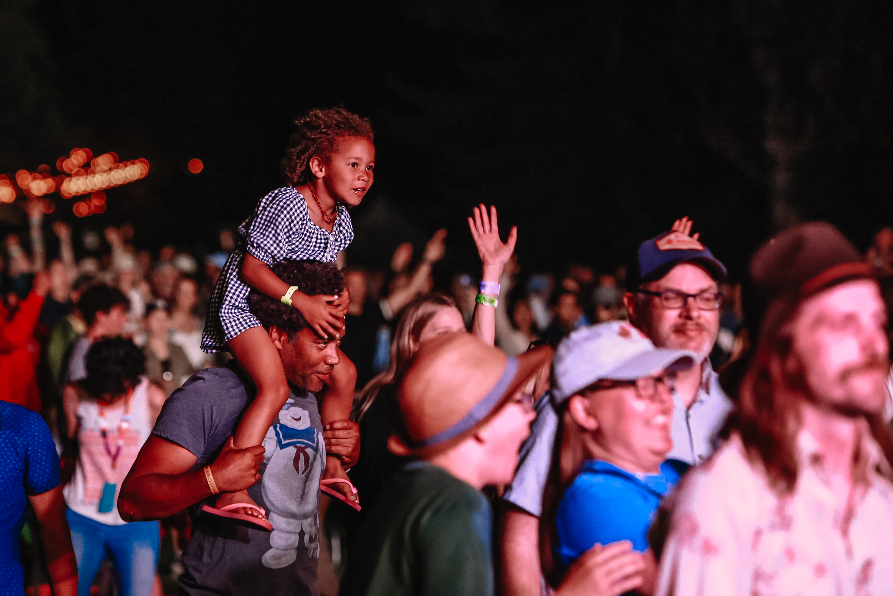 A youngster rides on the shoulders of a full grown folky at the Folk Fest. 