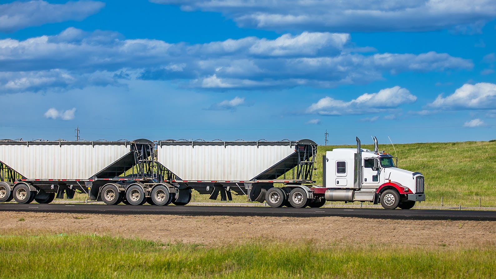 Cross border trade and market access - semi truck on Alberta highway