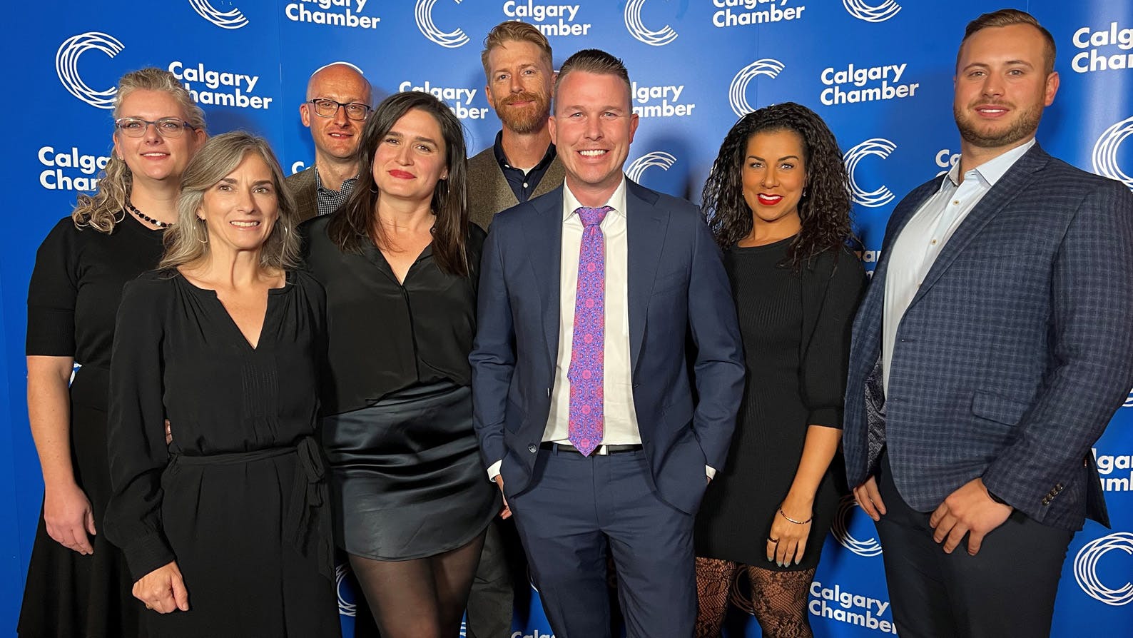 The Canadian Cannabis Exchange team posing after winning the Helcim Emerging Growth award at the Small Business Awards in 2022.