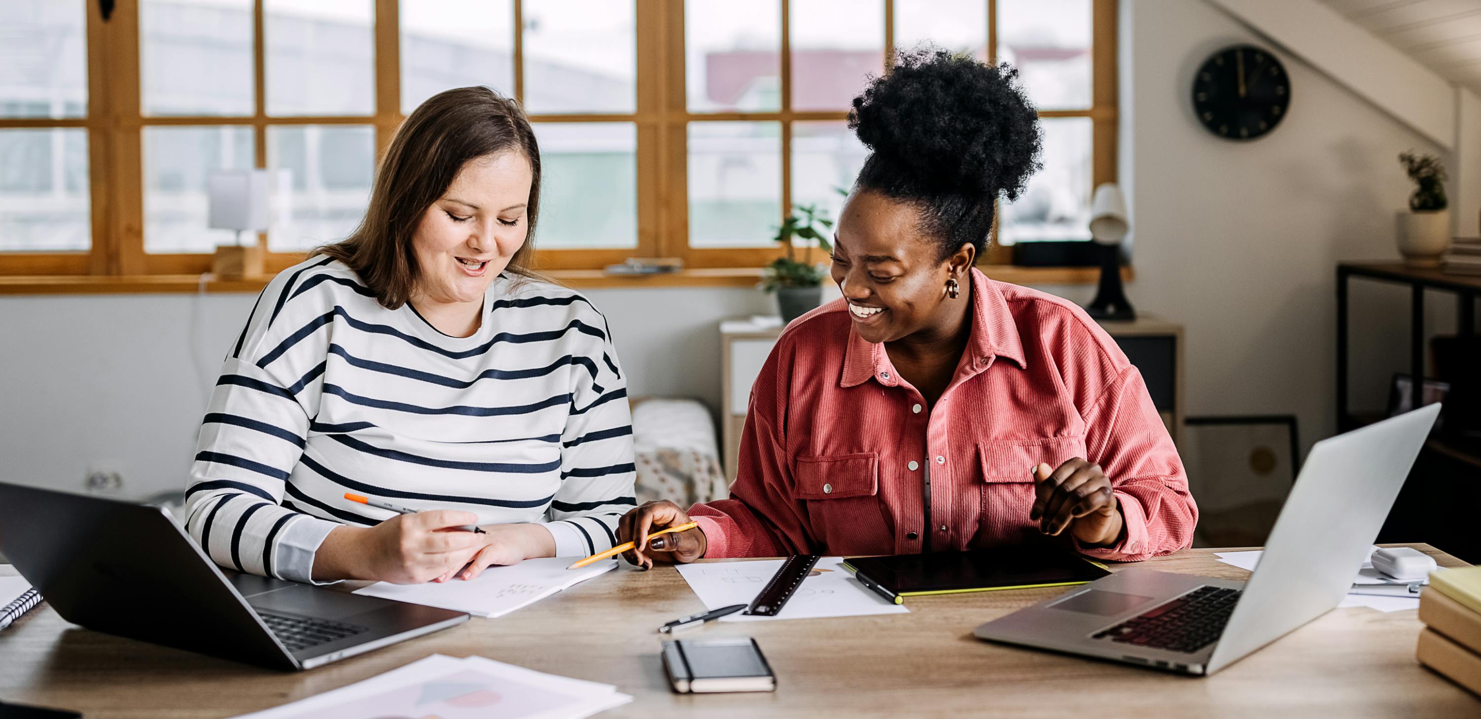 Two women being productive and motivated