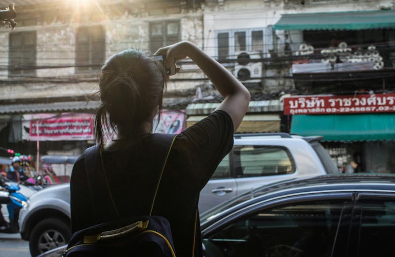 A girl traveling alone photographing the streets of Tokyo