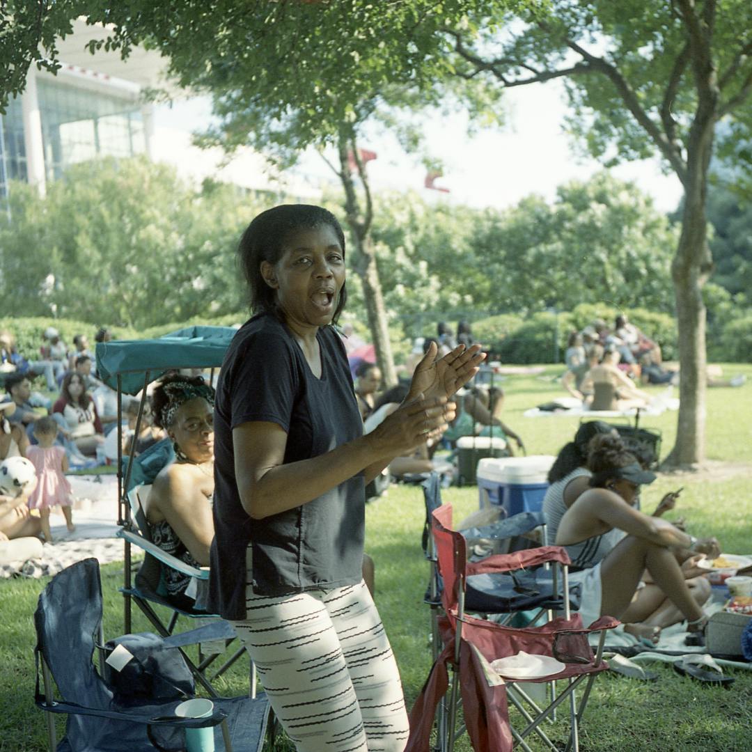 A lady dancing at an outdoor concert