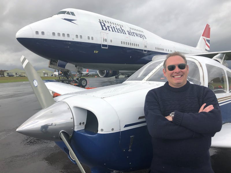 Our head of flight operations, Christian Ackroyd, stands in front of a BA Boeing 747.